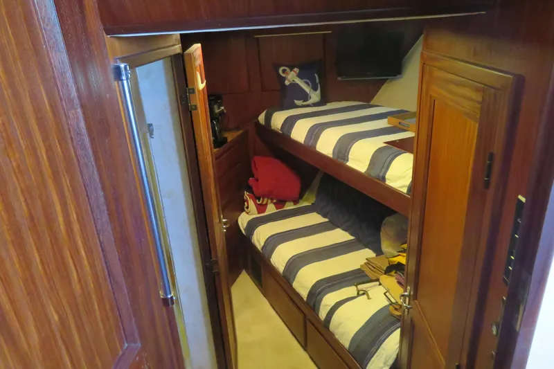 Rive' Gauche Yacht Photos Pics Bunk beds in 1986 Hatteras 58 Motor Yacht cabin with nautical decor.