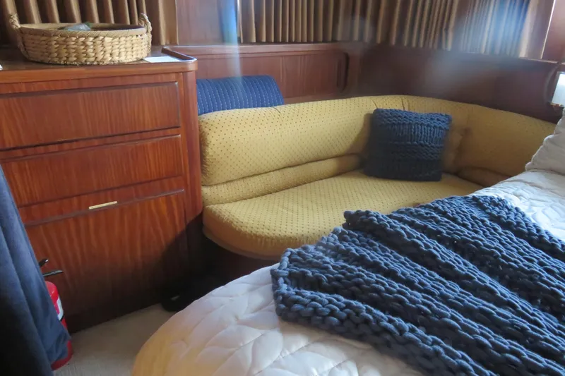 Rive' Gauche Yacht Photos Pics Interior of 1986 Hatteras 58 Motor Yacht with cozy seating and knitted decor.