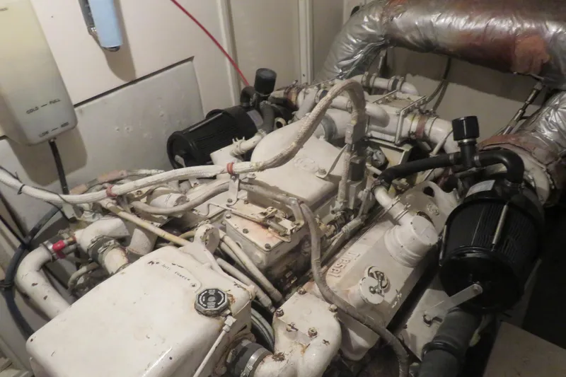 Rive' Gauche Yacht Photos Pics Engine room of a 1986 Hatteras 58 Motor Yacht, showcasing mechanical components.