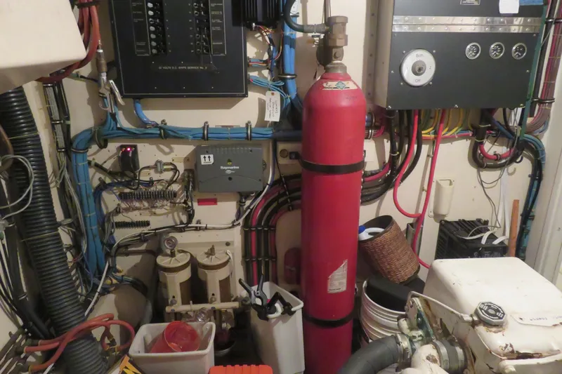 Rive' Gauche Yacht Photos Pics Engine room of a 1986 Hatteras 58 Motor Yacht with control panels and equipment.