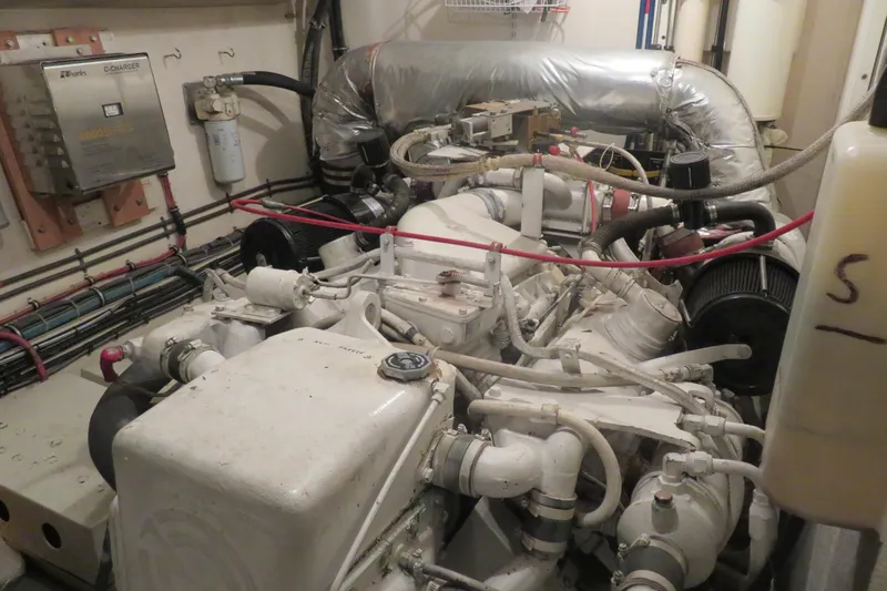 Rive' Gauche Yacht Photos Pics Engine room of a 1986 Hatteras 58 Motor Yacht, showcasing mechanical components.