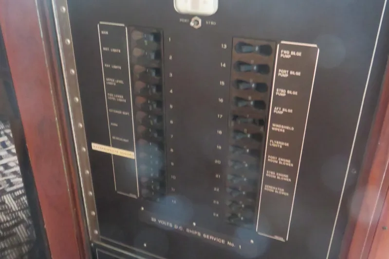 Rive' Gauche Yacht Photos Pics Electrical panel on a 1986 Hatteras 58 Motor Yacht, showing switches and labels.