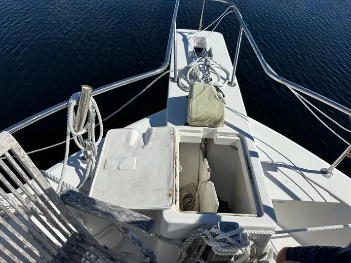 Northstar Yacht Photos Pics 2002 Mainship 430 Trawler bow with open storage compartments and ropes on deck.