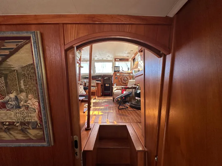 Northstar Yacht Photos Pics Interior view of 2002 Mainship 430 Trawler, showcasing wooden finishes and nautical decor.