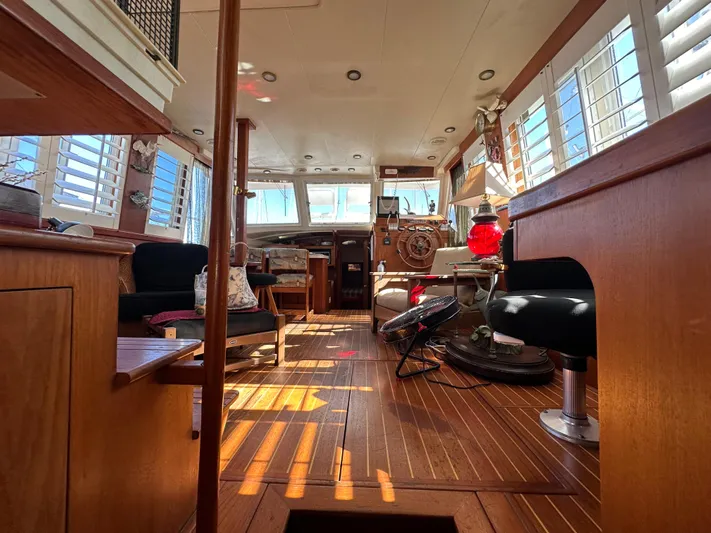 Northstar Yacht Photos Pics Interior of 2002 Mainship 430 Trawler with wooden flooring and seating area.