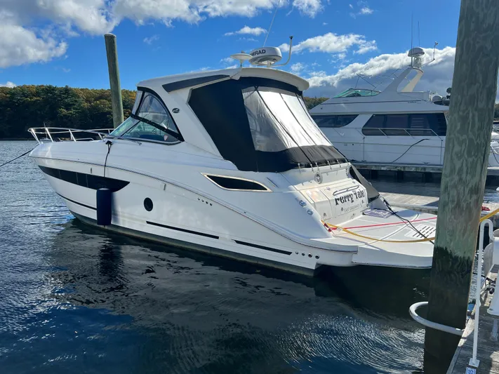 Yacht Photos Pics 2018 Sea Ray 350 Sundancer yacht docked at marina under blue sky.