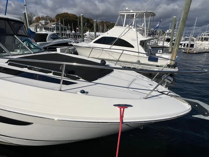  Yacht Photos Pics 2018 Sea Ray 350 Sundancer docked at a marina under cloudy skies.