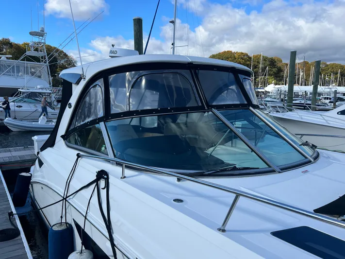  Yacht Photos Pics 2018 Sea Ray 350 Sundancer docked at marina under blue sky.