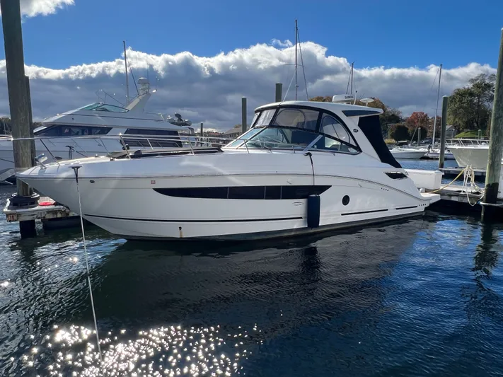  Yacht Photos Pics 2018 Sea Ray 350 Sundancer yacht docked in a marina under a clear blue sky.