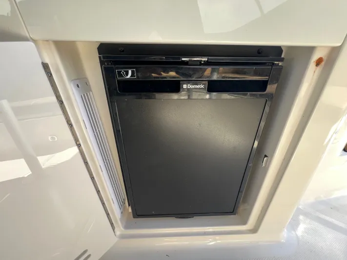  Yacht Photos Pics Dometic refrigerator on 2018 Sea Ray 350 Sundancer yacht, integrated into cabin interior.