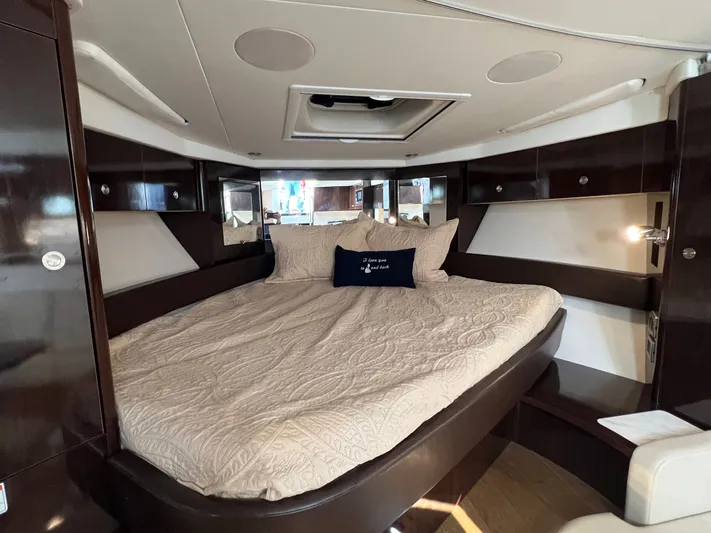  Yacht Photos Pics Luxurious interior cabin of 2018 Sea Ray 350 Sundancer with elegant bedding.