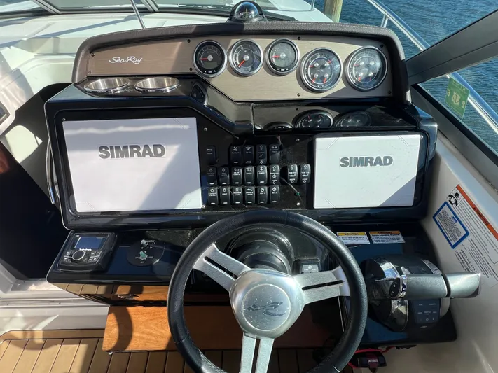  Yacht Photos Pics Cockpit of 2018 Sea Ray 350 Sundancer with Simrad navigation system and steering wheel.