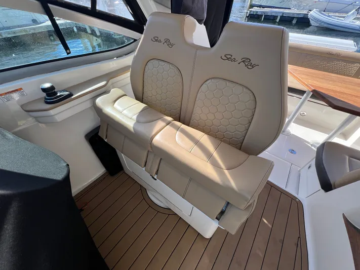  Yacht Photos Pics 2018 Sea Ray 350 Sundancer interior with beige leather seating and wood flooring.
