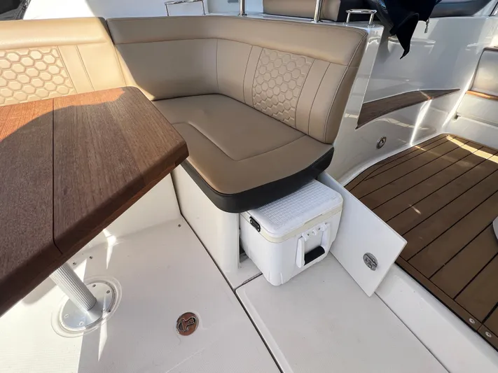  Yacht Photos Pics 2018 Sea Ray 350 Sundancer interior with tan seating and wooden table.