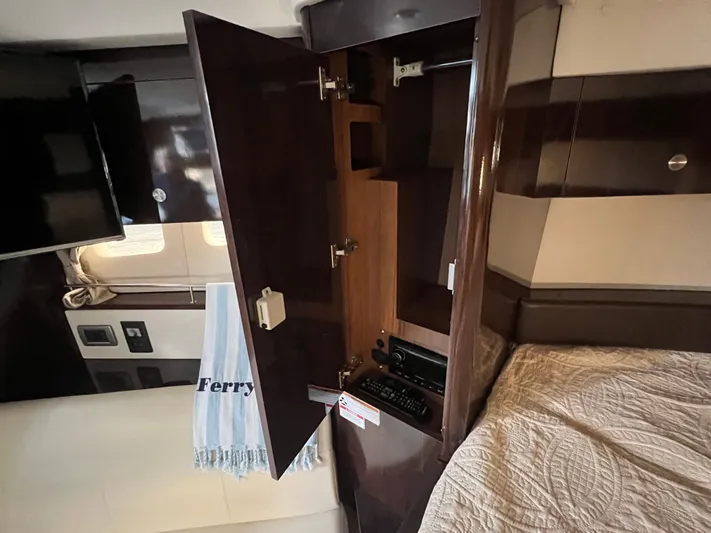  Yacht Photos Pics 2018 Sea Ray 350 Sundancer cabin with open wooden cabinet and bed.