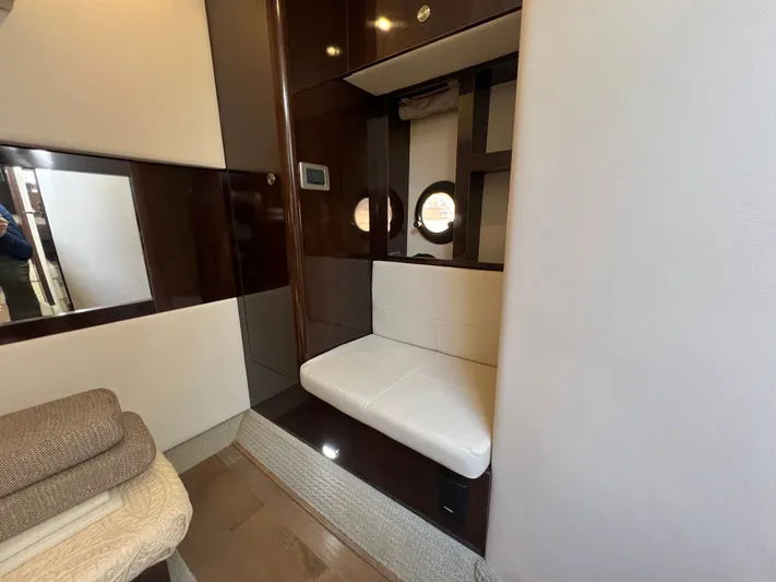  Yacht Photos Pics Interior of 2018 Sea Ray 350 Sundancer yacht with seating and porthole window.