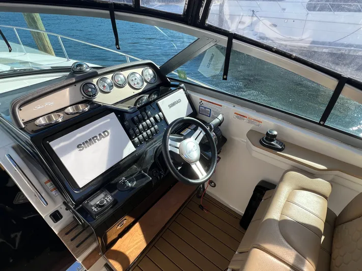  Yacht Photos Pics 2018 Sea Ray 350 Sundancer helm with Simrad electronics and leather seating.
