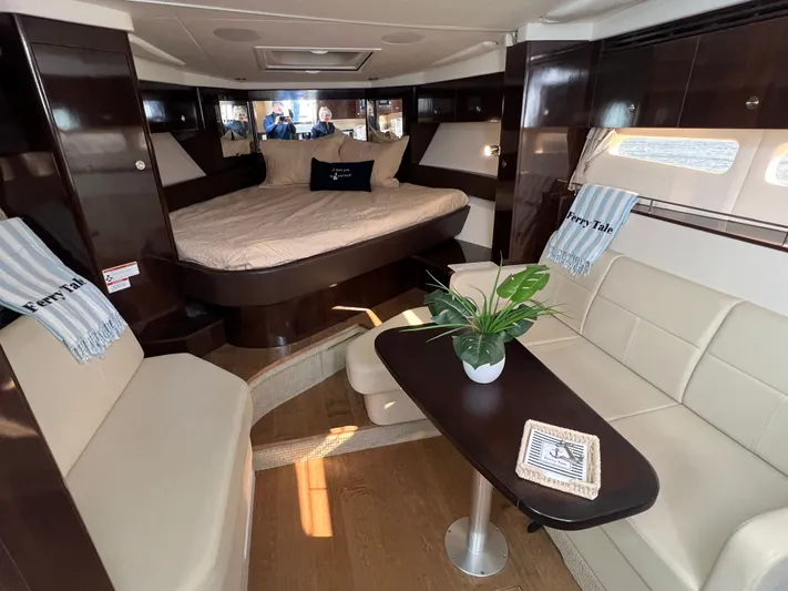  Yacht Photos Pics Luxurious interior of 2018 Sea Ray 350 Sundancer yacht with cozy seating and elegant decor.