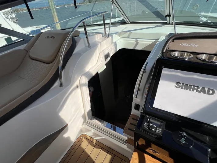  Yacht Photos Pics 2018 Sea Ray 350 Sundancer cockpit with Simrad navigation system and luxurious seating.