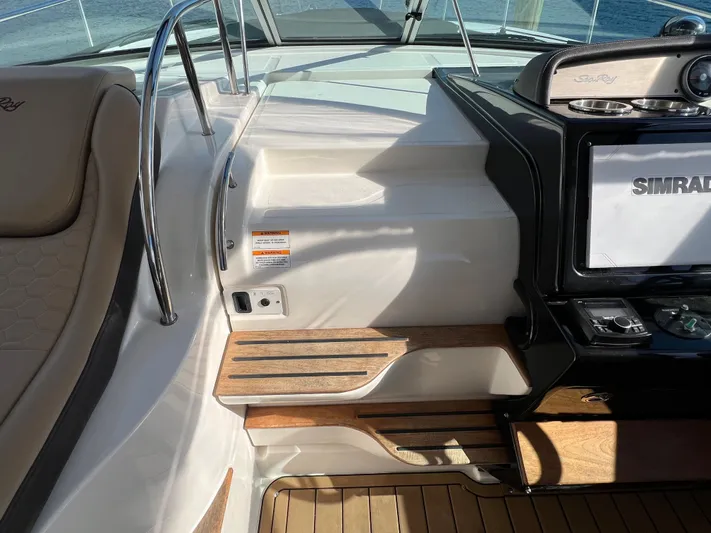  Yacht Photos Pics 2018 Sea Ray 350 Sundancer cockpit with Simrad display and teak flooring.