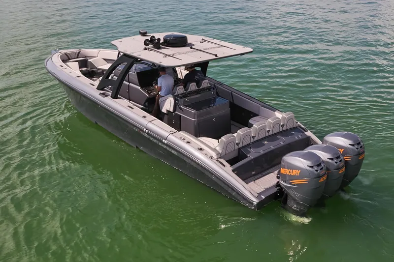  Yacht Photos Pics 2023 Midnight Express 37' Open boat with dual Mercury engines on calm water.