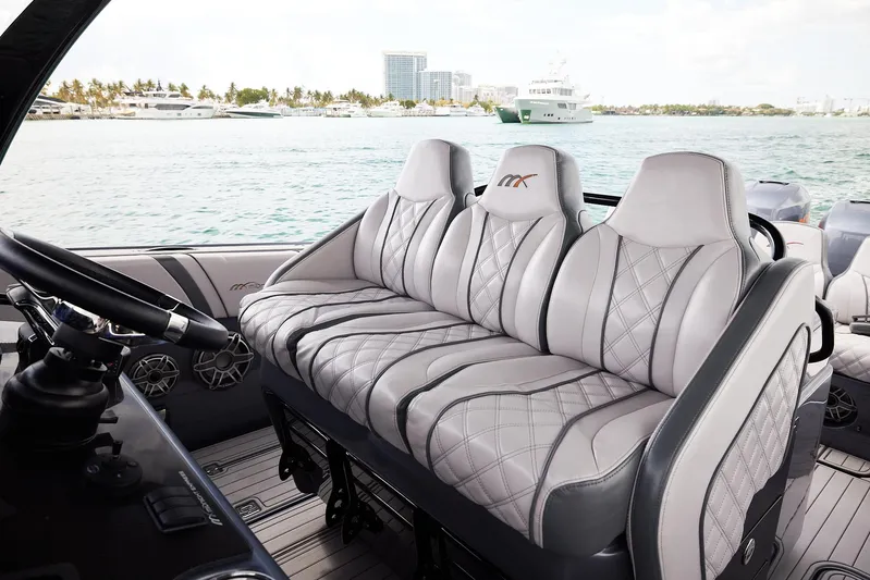  Yacht Photos Pics 2023 Midnight Express 37' Open boat interior with luxurious seating and waterfront view.