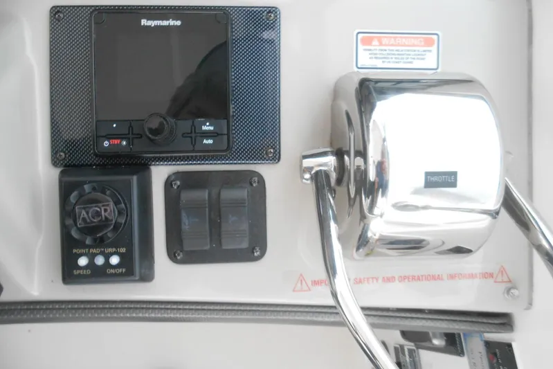 Yacht Photos Pics Control panel of 2007 Sea Ray 44 Sundancer with Raymarine display and throttle lever.