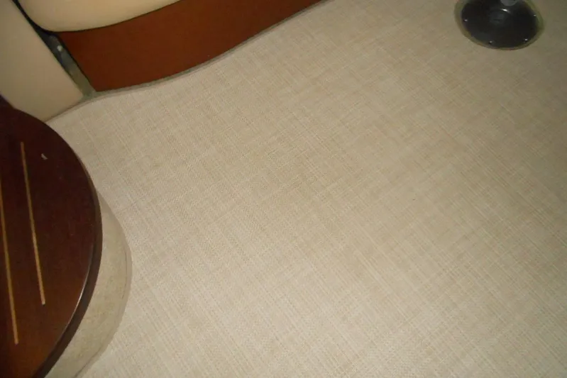  Yacht Photos Pics Interior view of 2007 Sea Ray 44 Sundancer boat, featuring beige upholstery and wooden accents.