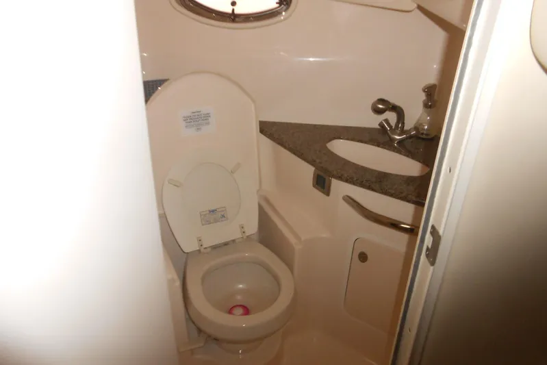  Yacht Photos Pics 2007 Sea Ray 44 Sundancer bathroom with toilet and sink, compact marine design.