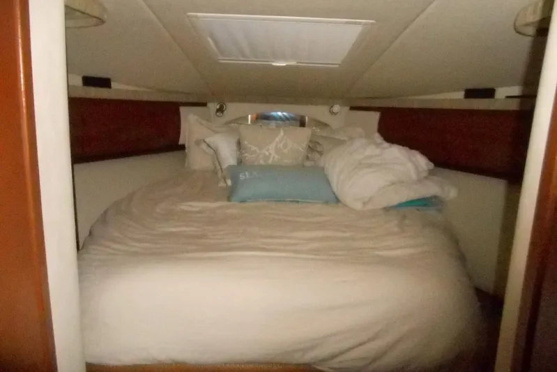  Yacht Photos Pics Cozy cabin interior of 2007 Sea Ray 44 Sundancer yacht with plush bedding.