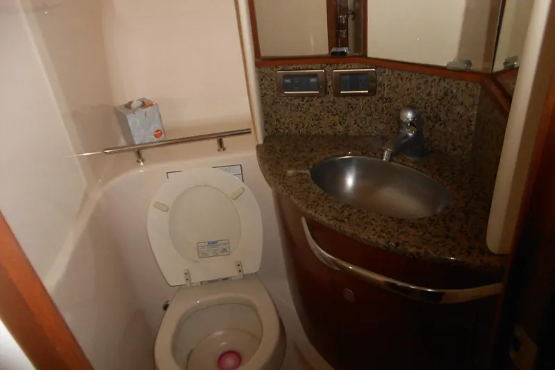 Yacht Photos Pics Bathroom interior of 2007 Sea Ray 44 Sundancer with granite countertop and stainless steel sink.
