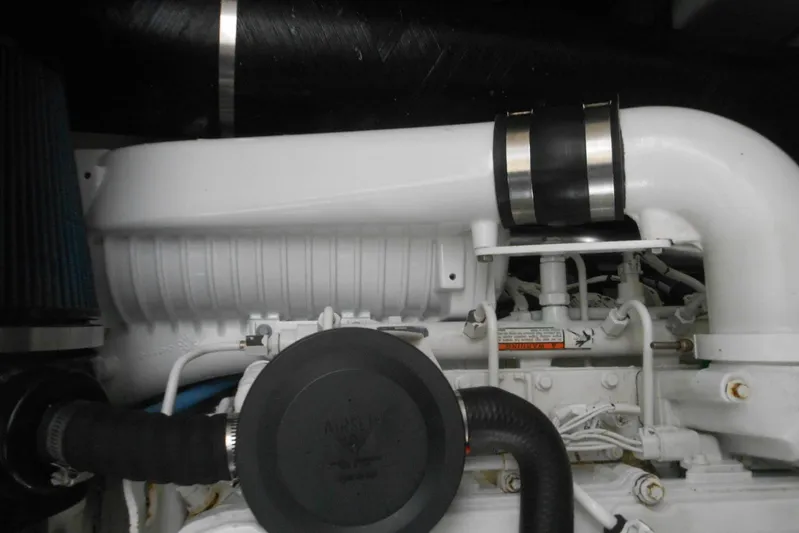  Yacht Photos Pics Engine compartment of a 2007 Sea Ray 44 Sundancer boat, showcasing mechanical components.