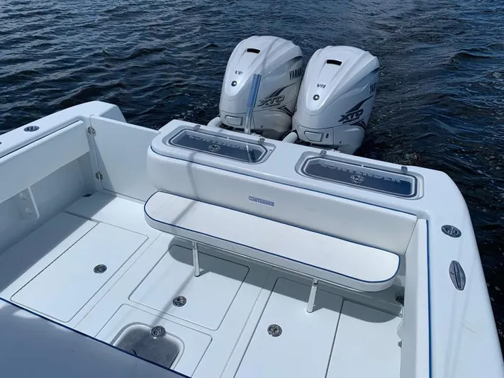  Yacht Photos Pics 2021 Contender 35 ST boat with twin outboard engines on water.