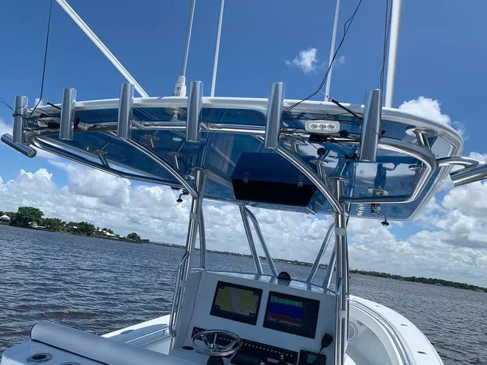  Yacht Photos Pics 2021 Contender 35 ST boat with advanced navigation system on a sunny day.