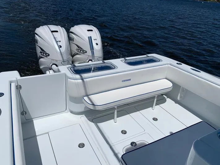  Yacht Photos Pics 2021 Contender 35 ST boat with twin outboard engines on calm water.