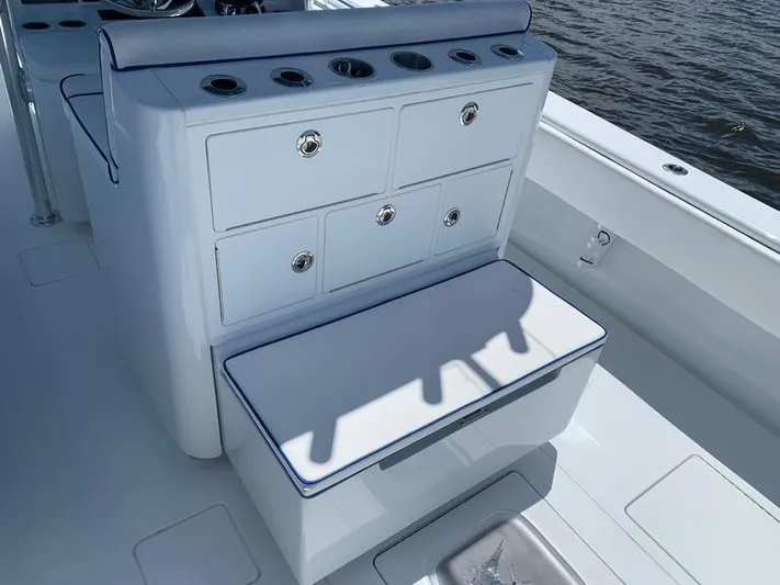  Yacht Photos Pics Contender 35 ST 2021 boat with storage drawers and cushioned seat on deck.