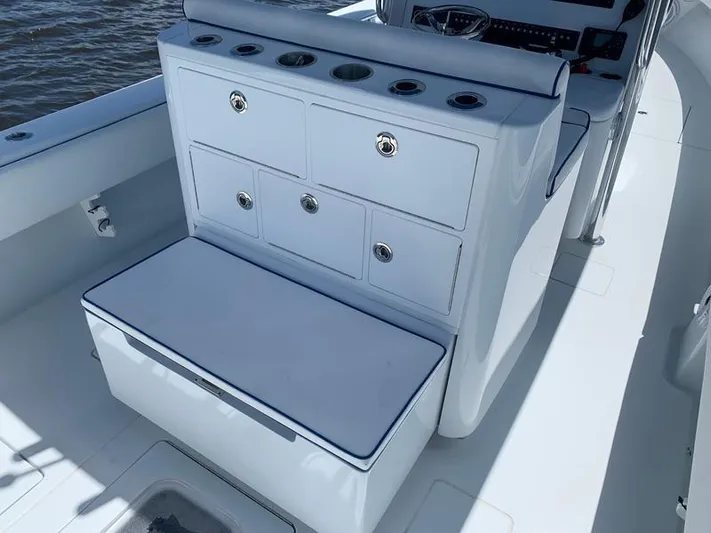  Yacht Photos Pics 2021 Contender 35 ST boat interior with storage compartments and cushioned seating.