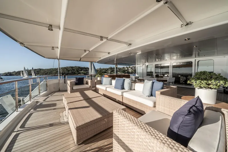 Moatize Yacht Photos Pics Luxurious deck of 1998 Pendennis Custom yacht with elegant seating and ocean view.