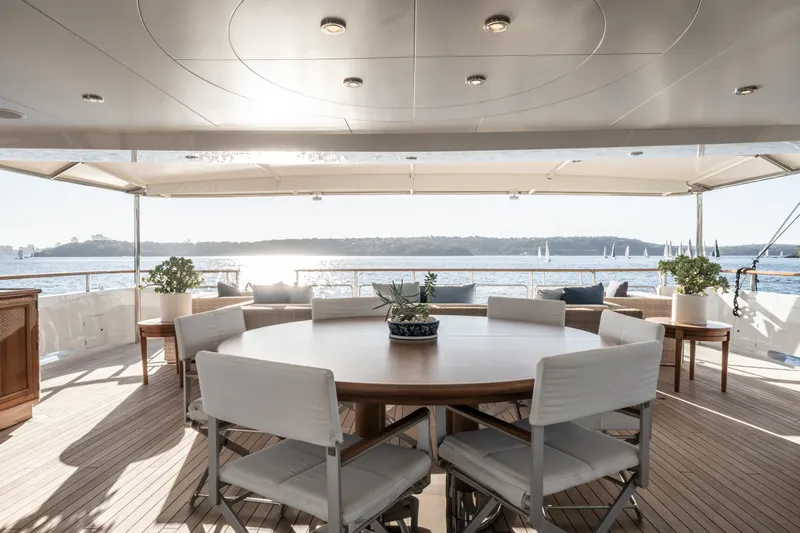 Moatize Yacht Photos Pics Luxurious Pendennis Custom yacht deck with round table, ocean view, and elegant seating, built in 1998.