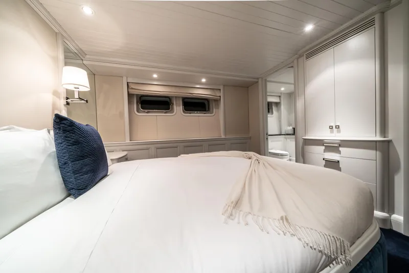 Moatize Yacht Photos Pics Luxurious Pendennis Custom 1998 yacht bedroom with elegant bedding and modern lighting.