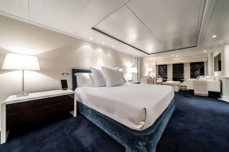 Moatize Yacht Photos Pics Luxurious bedroom interior on 1998 Pendennis Custom yacht with elegant furnishings and ambient lighting.