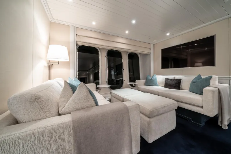 Moatize Yacht Photos Pics Luxurious Pendennis Custom yacht interior, 1998 model, featuring elegant sofas and modern decor.