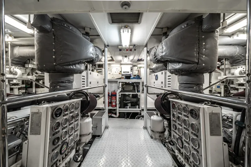 Moatize Yacht Photos Pics Engine room of 1998 Pendennis Custom yacht, featuring complex machinery and control panels.