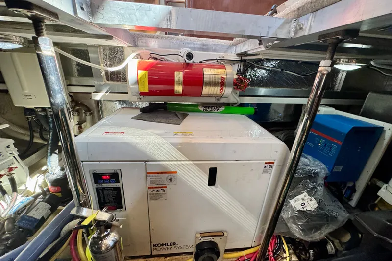 Water Baby Yacht Photos Pics Engine room of 2007 Carver 43 Motor Yacht with Kohler generator and fire extinguisher.