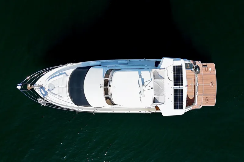 Water Baby Yacht Photos Pics Top view of a 2007 Carver 43 Motor Yacht on water.