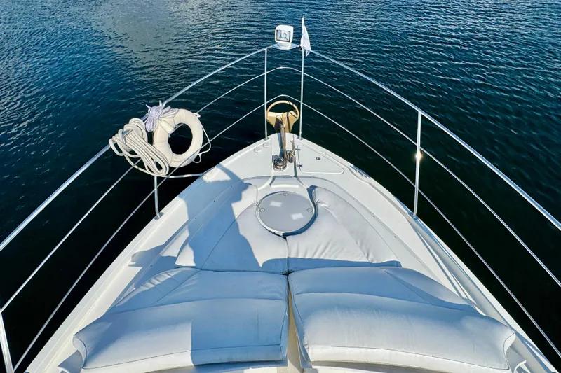 Water Baby Yacht Photos Pics Bow view of 2007 Carver 43 Motor Yacht with sun pads and life ring.