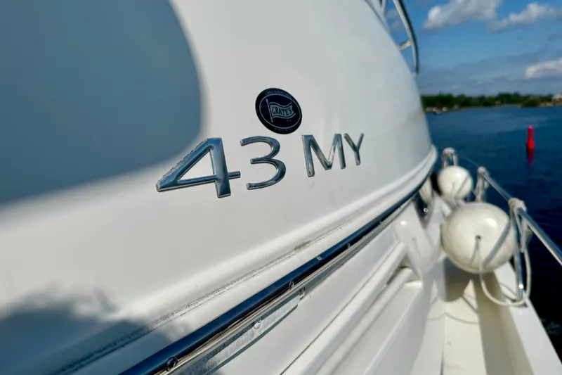 Water Baby Yacht Photos Pics 2007 Carver 43 Motor Yacht on water, close-up of model name.