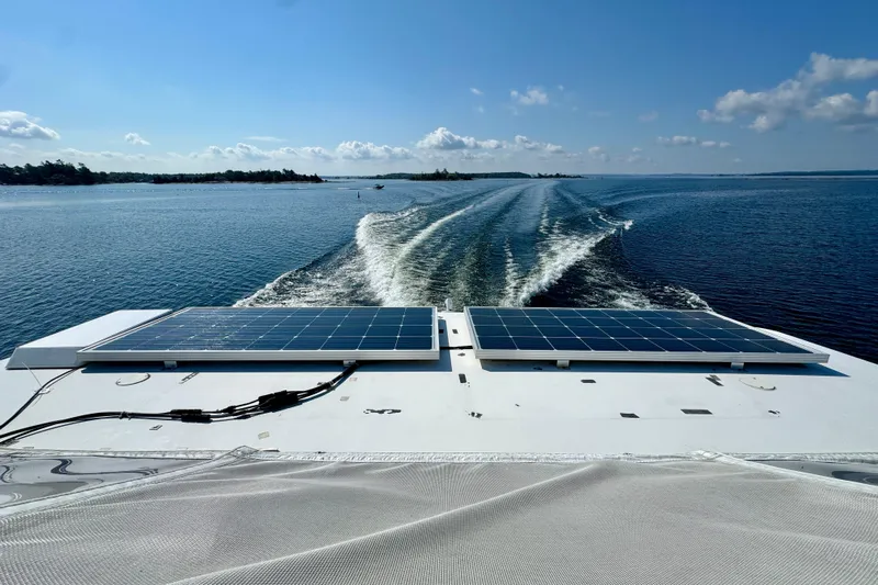 Water Baby Yacht Photos Pics 2007 Carver 43 Motor Yacht with solar panels cruising on a sunny day.