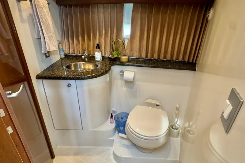 Water Baby Yacht Photos Pics Bathroom interior of 2007 Carver 43 Motor Yacht with sink and toilet.