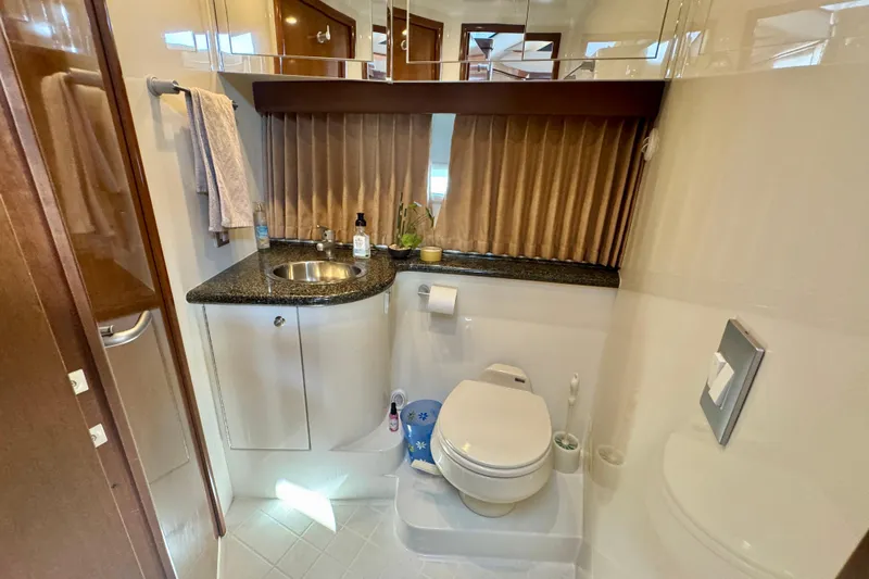 Water Baby Yacht Photos Pics Luxurious bathroom in 2007 Carver 43 Motor Yacht with modern amenities and elegant design.